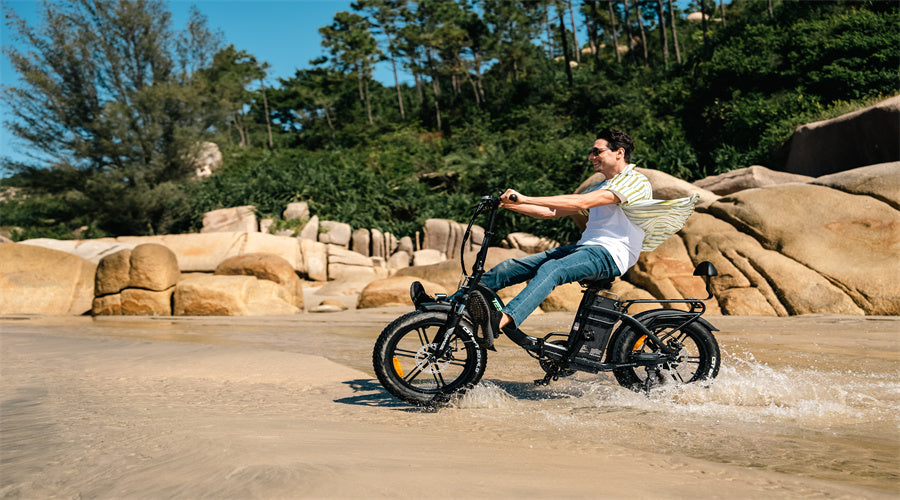 A man rides a TESWAY s5 ebike through a flooded area